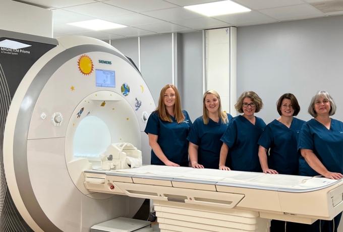 Some of the Edinburgh Imaging Facility team standing in front of the Imaging Facility
