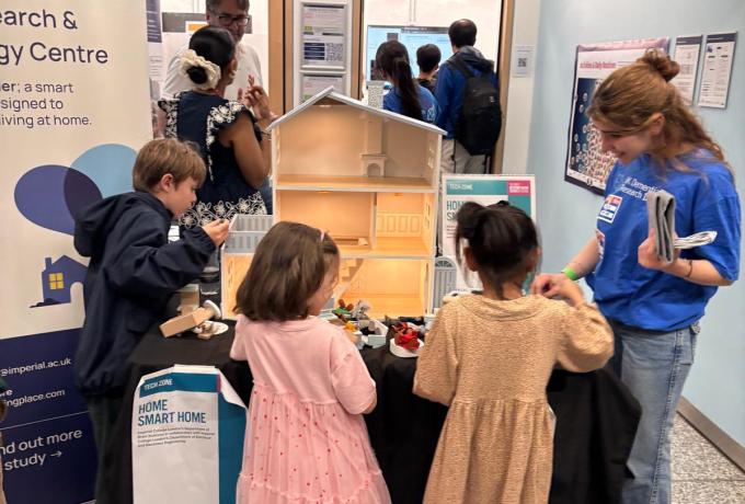 UK DRI researchers showcasing the 'home smart home' dollshouse