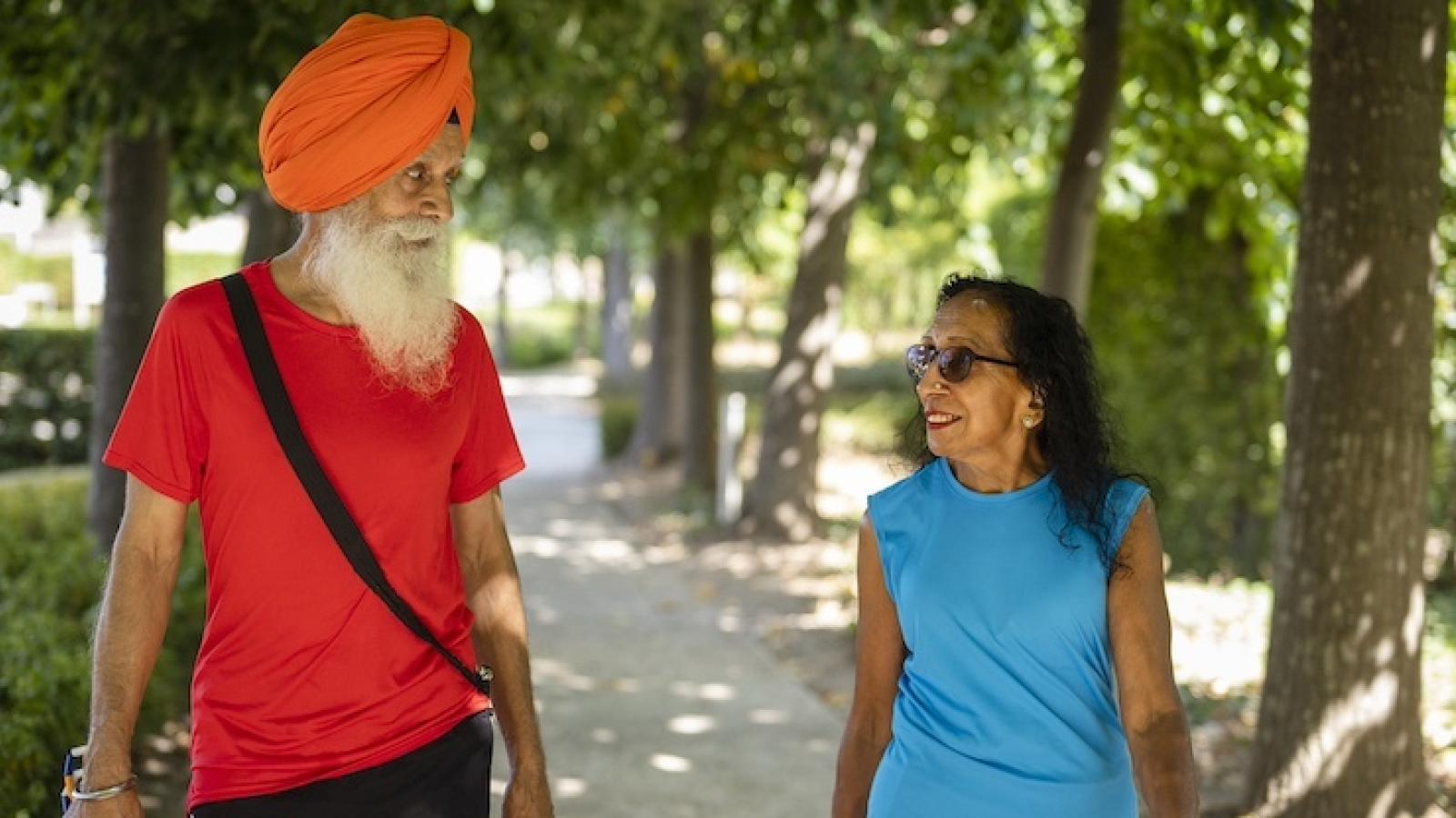 2 people walking in the park