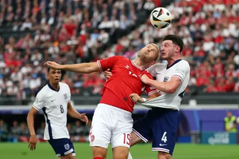 Footballers heading a ball